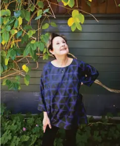  ?? Santiago Mejia / The Chronicle ?? Alice Waters, top, in the kitchen at Chez Panisse in Berkeley in 1990, and in her Berkeley backyard, above, in September.