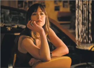  ?? Twentieth Century Fox / TNS ?? Dakota Johnson in “Bad Times at the El Royale.” Set over one night in the late ’60s, the film follows a group of misfits who check into the deserted El Royale hotel in Lake Tahoe and retire to their rooms, where all their secrets come out to play.