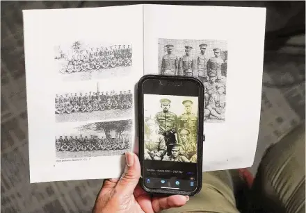  ?? Photos by Elizabeth Conley/Staff photograph­er ?? Angela Holder, whose great uncle was killed following the Houston riot of 1917, holds a photo of him at Camp Logan.