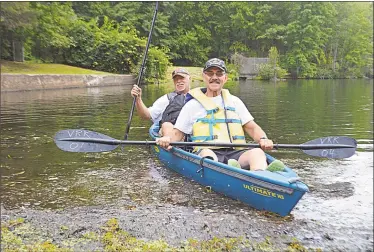  ?? Cassandra Day / Hearst Connecticu­t Media ?? The U.S. Veterans Rowing &amp; Kayaking Foundation launched its newest division on Friday at the Polish Falcons Club at Crystal Lake in Middletown. Founder Paul-Stephen Varszegi, of Trumbull, (not pictured), secretary Jerry Augustine, of Middletown, front, and Dean Buden of Plainville, were among those who attended the cookout.