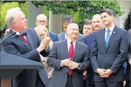  ?? CHERISS MAY/SIPA USA ?? Tom Price, secretary of Health and Human Services, applauds GOP members, including Speaker Paul Ryan, right, on May 4 after passage of a House bill to repeal Obamacare.