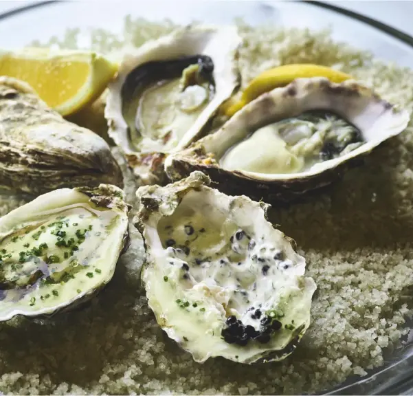  ??  ?? The world is your oyster: this decadent dish of oysters in jelly, flavoured with mussels and trout, reveals wonder in every mouthful