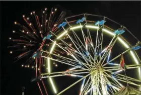  ?? BOB KEELER — DIGITAL FIRST MEDIA FILE PHOTO ?? Fireworks are seen behind the Ferris wheel at last year’s Penn Valley Community Fair. This year’s fair will run June 13 to 17.