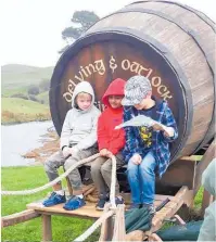  ??  ?? Sitting together at the barrel at Hobbiton from left Liam Lilly, Ayu Patel and Cooper Powell.