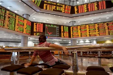  ??  ?? Malaysia’s equity and foreign exchange markets have begun their uptrend, albeit at a slow pace, tracking the positive sentiment, globally, and the trend is likely to continue next week, according to economists. — AFP photo