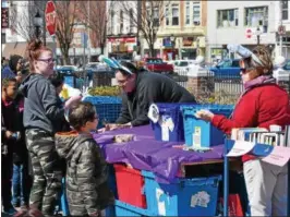  ?? MARIAN DENNIS — DIGITAL FIRST MEDIA ?? Kids stopped by Rite Aid on East High Street Saturday to collect eggs as part of the downtown Pottstown Egg Hunt.