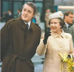  ?? PIERRE OBENDRAUF / POSTMEDIA NEWS FILES ?? Mulroney with Queen Elizabeth as she prepares to leave from the airport in Quebec City on Oct. 24, 1987.