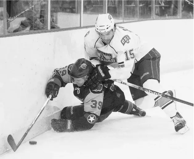  ?? SUPPLIED: STEVEN CHRISTY/ OKC BARONS ?? Philippe Cornet, right, seen in action against the Houston Aeros, scored a team-high 24 goals for the AHL’s Oklahoma City Barons last season.