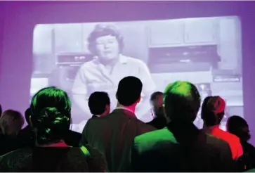  ?? PHOTOS: CAROLINE PHILLIPS/OTTAWA CITIZEN ?? Guests briefly watch old footage of Julia Child during the national launch party for Gusto TV, held Wednesday at the Canada Aviation and Space Museum.