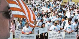  ?? JAHI CHIKWENDIU/WASHINGTON POST ?? Skilled immigrants, including doctors and engineers, rally in 2007 on Capitol Hill in Washington to protest long delays in getting green cards. Now, the delays are longer than ever.