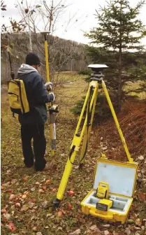  ??  ?? A modern surveyor uses GPS computer technology along with various sciences for extremely accurate results.