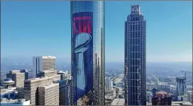  ?? HYOSUB SHIN / HSHIN@AJC.COM ?? Super Bowl branding is beginning to appear on The Westin Peachtree Plaza in downtown Atlanta. Rooms throughout Metro Atlanta are quickly selling out with many visitors expected to turn to Airbnbs for lodging.