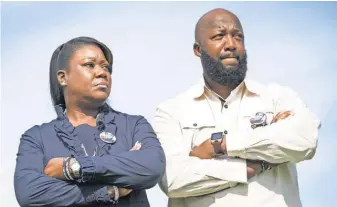  ?? JACK GRUBER, USA TODAY ?? Tracy Martin and Sybrina Fulton on the Forzano Park football field where their slain son TrayvonMar­tin once played. Both are seriously considerin­g becoming more politicall­y involved.