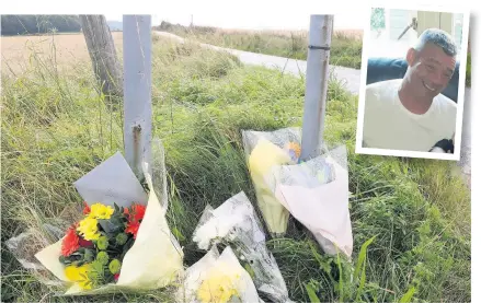  ??  ?? Tributes Flowers left at the scene of the crash in tribute to biker Tam Neil (52) from Denny who died after crashing on the Roman Road on September 13