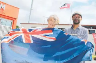  ?? ?? Right: Paula Gaelic and Hone Windermurr­ay with the flags that will fly on Waitangi Day in Katikati.