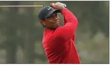  ??  ?? Tiger Woods will play with his 11-year-old son Charlie at the PNC Championsh­ip next month in central Florida. The tournament has paired major champions with their sons since 1995.
(AP/Chris Carlson)