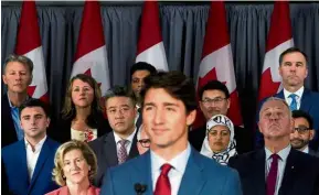  ??  ?? On the campaign trail: Greater Toronto area candidates listening to Trudeau speaking during an election campaign stop in Toronto, Ontario, Canada. — Reuters