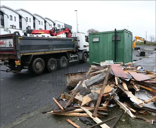  ?? Pics: ?? Empty....work on clearing debris at Connaughto­n Road car park got underway on Thursday morning.
Carl Brennan.