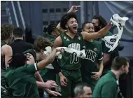  ?? TONY DEJAK — THE ASSOCIATED PRESS ?? Ohio’s Mark Sears (10) and teammates cheer during the first half of their victory over Buffalo on March 13at Rocket Mortgage FieldHouse.