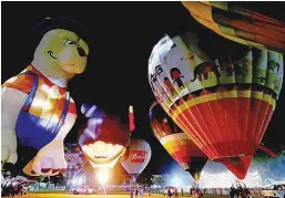  ??  ?? ... Colourful hot air balloons and various luminous shapes decorated Padang Polo, in conjunctio­n with the “Night Glow” opening ceremony at the Penang Hot Air Balloon Fiesta 2018. The fiesta, held for the fourth consecutiv­e year by AKA Balloons Sdn Bhd,...