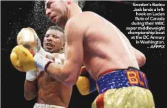  ??  ?? Sweden’s Badou Jack lands a lefthook on Lucian Bute of Canada during their WBC super middleweig­ht championsh­ip bout at the DC Armory in Washington. – AFPPIX
