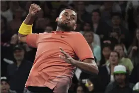  ?? LEE JIN-MAN - THE ASSOCIATED PRESS ?? Australia’s Nick Kyrgios celebrates after defeating France’s Gilles Simon in their second round singles match at the Australian Open championsh­ip in Melbourne, Australia, Thursday, Jan. 23, 2020.