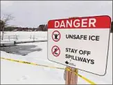  ?? Will Waldron / Times Union ?? A warning sign is seen Feb. 2 near Long Pond at Grafton Lakes State Park in Grafton. Unseasonab­le warmth has helped create unsafe ice conditions this winter.