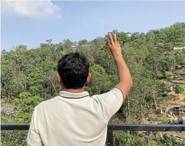  ?? /Reuters ?? Haven: An ousted member of parliament from Myanmar flashes a three-finger salute at an undisclose­d location in northeaste­rn India earlier this week. At least 1,800 people from Myanmar have taken shelter in the country.