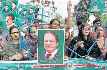  ?? AP FILE ?? Supporters of Pakistan's PM Nawaz Sharif chant slogans at a rally to condemn the dismissal of their leader, in Lahore.