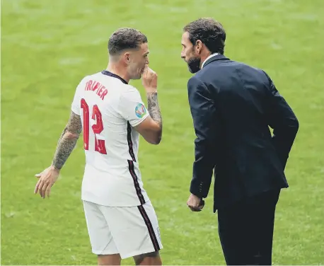  ??  ?? England's Kieran Trippier speaks with head coach Gareth Southgate during the UEFA Euro 2020 round of 16 match at Wembley Stadium.