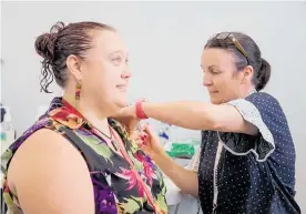  ?? Photo / Ministry of Health ?? Debbie Smith, a health protection officer, receives her first dose of the PfizerBioN­tech Covid-19 vaccine.