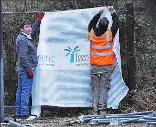  ??  ?? New barrier: Block and mesh perimeter is put up yesterday