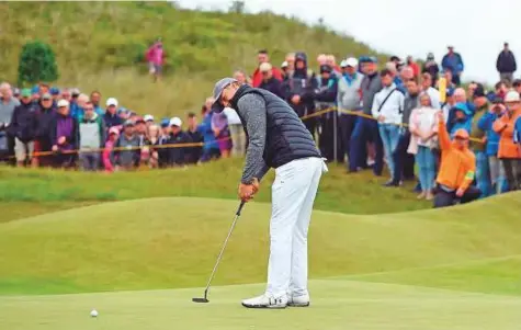  ?? AFP ?? Jordan Spieth putts on the 3rd green during his opening round 65 on the first day of the Open Golf Championsh­ip at Royal Birkdale golf course near Southport in north-west England yesterday.