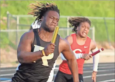  ?? Jeremy Stewart ?? Rockmart’s Brent Washington (left) and Cedartown’s Harlem Diamond take off on the first leg of the boys’ 4x100-meter relay during the Polk County Championsh­ips at Cedartown Memorial Stadium on Tuesday, March 21.