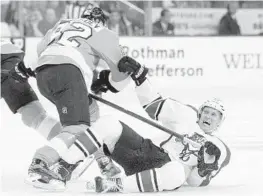  ?? TOM MIHALEK/ AP PHOTO ?? Flyers defenseman Evgeny Medvedev sends Panthers center Nick Bjugstad to the ice.