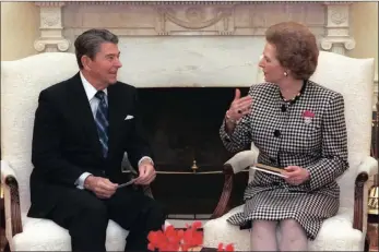  ?? PICTURES: NELSON MANDELA FOUNDATION AND WIKIPEDIA ?? Ronald Reagan and Margaret Thatcher at the White House in 1988. The two saw eye-to-eye on South Africa but were powerless to stop sanctions against apartheid escalating.