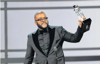  ?? REUTERS ?? Movie mogul Tyler Perry accepts the Ultimate Icon award Los Angeles in June 2019.Perry says he will accommodat­e cast and crews on his former Army base production facility in order to start filming in July.