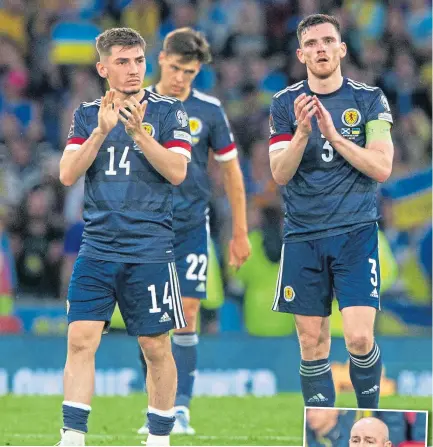  ?? ?? Scotland players were left disappoint­ed following the defeat to Ukraine