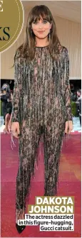  ?? ?? The actress dazzled in this figure-hugging, Gucci catsuit. DAKOTA JOHNSON