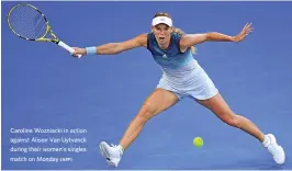  ?? (AFP) ?? Caroline Wozniacki in action against Alison Van Uytvanck during their women's singles match on Monday