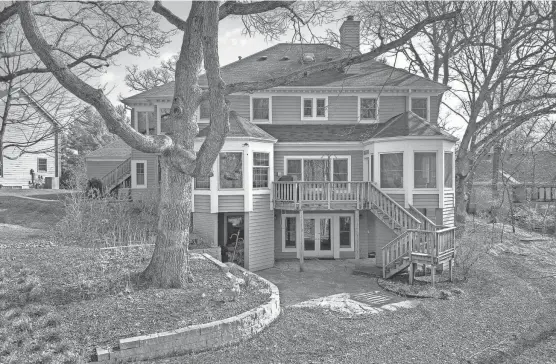  ?? FLOW PHOTOS/SPECIAL TO THE REGISTER ?? This six-bedroom house on the market for $1.05 million in Ankeny backs onto a forest preserve and features an elevator connecting all three levels. Here, a look at the back of the 3,720-square-foot house.