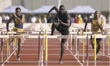  ?? Kim Komenich / The Chronicle 2004 ?? Logan’s Kevin Craddock (center) set a meet record of 13.39 seconds for the 110meter hurdles at the 2004 CIF Finals.