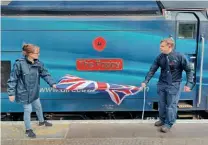  ?? DRS ?? Jane Ayres from the Royal British Legion and DRS driver David Poynter unveil No. 68033’s name at Euston.