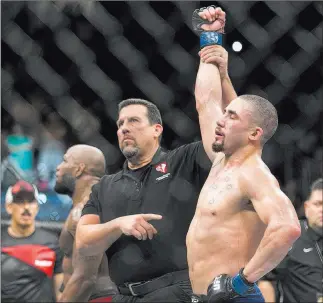  ?? Erik Verduzco Las Vegas Review-journal @Erik_verduzco ?? Middleweig­ht Robert Whittaker, being announced as the winner of a 2017 bout vs. Yoel Romero, had to pull out of UFC 234 because of emergency surgery.