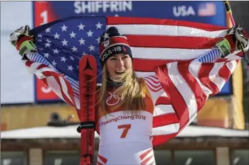 ??  ?? Mikaela Shiffrin, of the United States, celebrate her gold medal during the venue ceremony at the Women’s Giant Slalom at the 2018 Winter Olympics in Pyeongchan­g, South Korea on Thursday. AP PHOTO/MORRY GASH