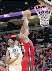  ?? JOHN MCCALL/STAFF PHOTOGRAPH­ER ?? Heat forward Bam Adebayo gets a block against Utah Jazz forward Ekpe Udoh in the first half Sunday.