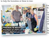  ?? ?? FRIENDS IN NEED Volunteers at LifeHouse prepare vital food parcels