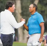  ?? Lynne Sladky / Associated Press ?? Phil Mickelson, left, and Tiger Woods shake hands after the first round of the Players Championsh­ip May 10 in Ponte Vedra Beach, Fla.