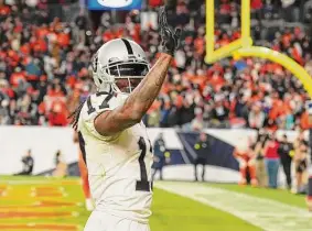  ?? Jack Dempsey / Associated Press ?? Raiders wide receiver Davante Adams celebrates after scoring the winning touchdown on a 35-yard play against the Broncos in overtime.