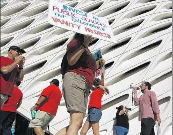  ?? Rick Loomis ?? MEMBERS OF the United Teachers Los Angeles union protest at the Broad last month. Eli and Edythe Broad Foundation is spearheadi­ng a plan to open 260 charter schools in L.A. in eight years.